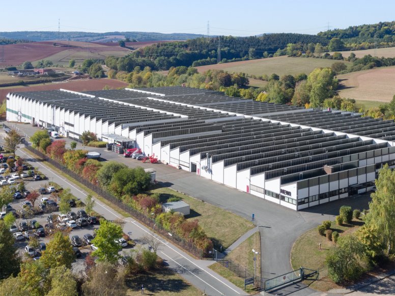 Drone image of the HEWI plant with white facade